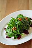 A rocket salad with beetroot, walnuts and feta cheese