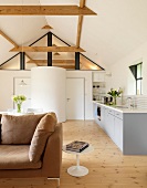 Sofa and side table in open-plan room