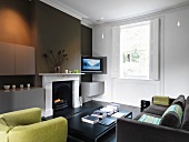 Living room with sofa, armchair and fireplace