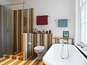 Bathroom with multi-coloured tiling