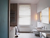 White bathroom with closed blinds
