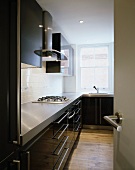 Modern kitchen with fitted cupboards and gas cooker