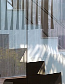 View of stairs and balustrade through glass wall