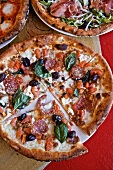 Three Assorted Pizzas;Pepperoni and Olive, Prosciutto Salad, Mozzarella and Basil; From Above