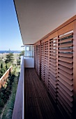 Wooden blinds on balcony windows