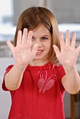 A girl showing floury hands