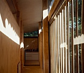 Hall with wood panelling and floor-to-ceiling windows