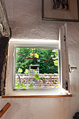 Open window with view of roof of neighbouring house