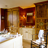 Vintage bathroom with fitted cupboards and traditional washstand