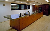 Long kitchen island in open-plan living space