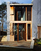 Two-storey extension with glass door