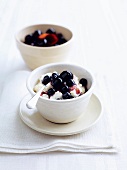 Rice pudding with poached cherries and blueberries