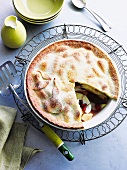 An autumnal pies filled with apples, pears, quinces and cranberries