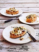 Toasted baguette topped with mushrooms and cabbage