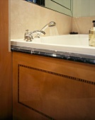 Wood panel with inlay work on bathtub