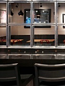 Mirrored wall with counter and stools