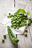 Fresh peas on paper