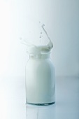 Milk being poured into a bottle