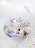 A bowl of vanilla crescent biscuits