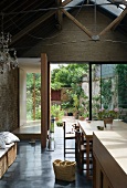 Living space with dining area & view of terrace & courtyard