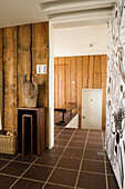 Hallway with wood panelling and rustic decorative elements