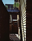 Modern house with wooden facade and metal balcony