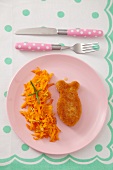 Fish-shaped fish fillet with grated carrots
