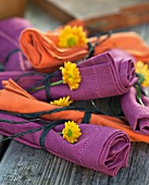 Rolled up napkins decorated with flowers