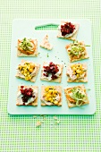 Party crackers topped with cucumber, beetroot and sweetcorn