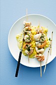 Seafood kebabs on a bed of saffron risotto