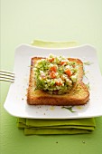 A slice of toast topped with asparagus tatar