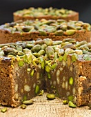 Chocolate cake with pistachios and pine nuts