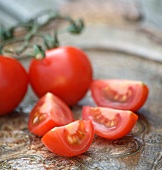 Tomatoes, whole and quartered