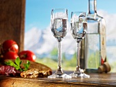 Two glasses of schnapps for supper against an alpine backdrop