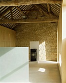 View of rustic roof timbers in renovated and modernised farmhouse