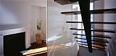 Staircase with glass partition in living space