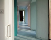 View into corridor with recurrent wave-shaped wall