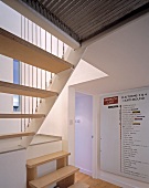 Foyer with modern staircase in apartment block
