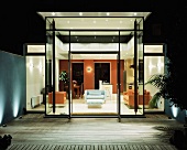 View of illuminated living room from terrace