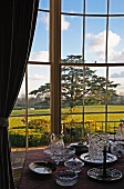 View of grounds of English manor house from dining room