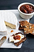 Brie with Crackers and Spicy Jam; On Stone Surface