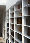 Tapered edge profiles make made-to-measure shelving appear slender and light