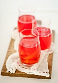 Compote made of summer fruits in three glasses