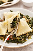 Potato pockets with spinach, chilli and pine nuts