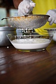 Coconut milk being made