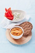 Chickpea puree with crispbread and herb cream cheese with pepper strips