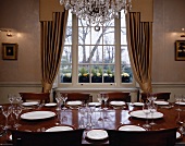 Set table in front of window with view of trees