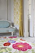Cheerful floral pattern on rug in front of upholstered, Rococo-style bench