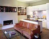 Old leather couch against kitchen counter