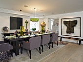 Festive set table with upholstered chairs in modern dining room